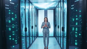Atractive woman head IT administrator using smartphone activating high tech server room with one click smiling working at data center. - Powered by Shutterstock - Get 15% off with code: PIKWIZARD15