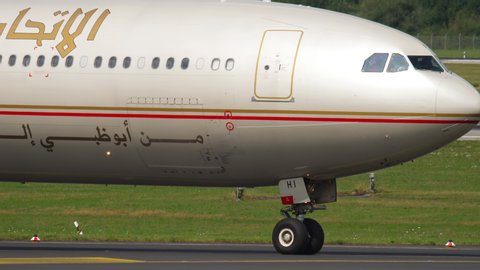 DUSSELDORF, GERMANY - JULY 22, 2017: Etihad Airbus A340 A6-EHI taxiing before departure. Dusseldorf Airport, Germany