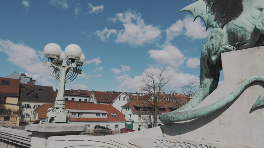 Camera moving Shot. Famous Dragon statue on Dragon bridge (Zmajski most), symbol of Ljubljana, capital of Slovenia.