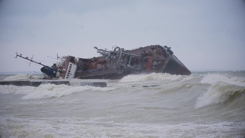 Tanker ship washed ashore during a sea storm. Oil spills
