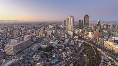 Nagoya Japan time lapse 4K, city skyline day to night timelapse at Nagoya railway station and business center