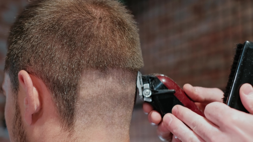 cutting hair with electric razor