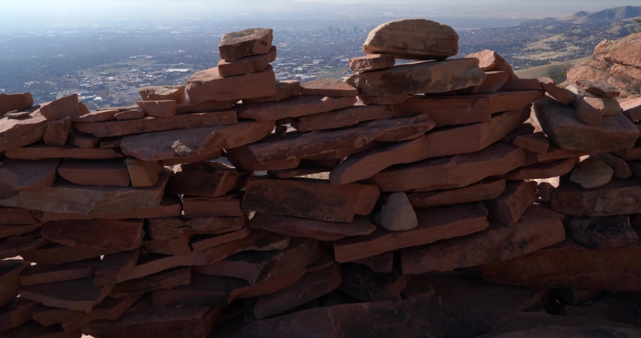 View over a small wall made out of local rocks on top of hill