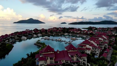 Sunset in the Seychelles island of Mahe.A drone flies over the ocean.Aerial video footage of Seychelles attractions.An artificial island in the form of a fish is called Eden.Premium travel destination