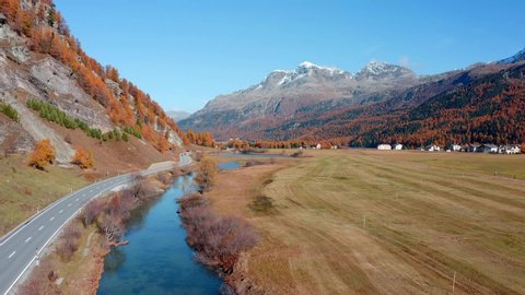 4k drone forward video (Ultra High Definition). Picturesque autumn view of Sils im Engadin village. Captivating morning scene of Swiss Alps, Sils lake, Switzerland, Europe. 