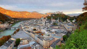Spectacular cityscape of Salzburg, Old City, birthplace of famed composer Mozart. Colorful autumn scene of  Eastern Alps. Nice morning landscape with Salzach river. Full HD video (High Definition).