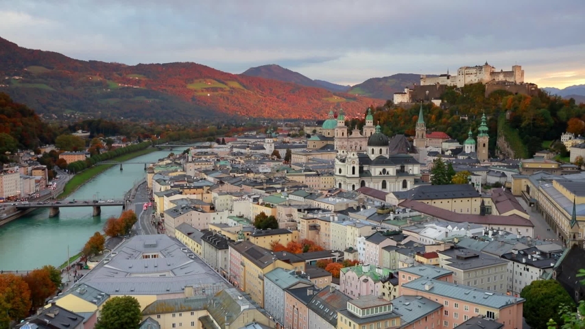 Time lapse clip. Beautiful sunset on Salzburg, Old City, birthplace of famed composer Mozart. Colorful autumn scene of Salzach river, Eastern Alps. Full HD video (High Definition).