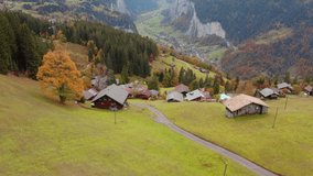 4k drone forward video (Ultra High Definition) of Wengen village, district of Lauterbrunnen. Awesome morning scene of Swiss Alps. Aerial autumn landscape of Switzerland countryside, Europe.