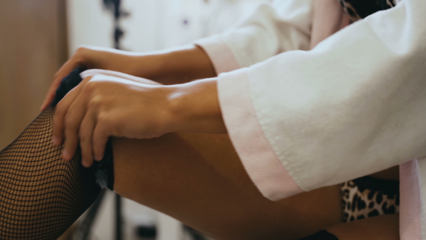 Young Beautiful Woman In Lingerie And Bathrobe At Home