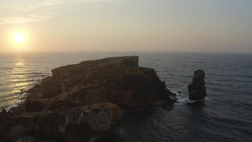 Aerial view of the coastline and cliffs during sunset near the city of Peniche. Portugal in the summer