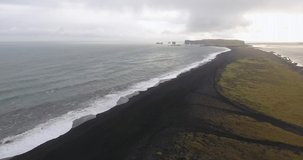 Drone view coastal line of the beach with black sand in Reynisfjara near Vik in Iceland