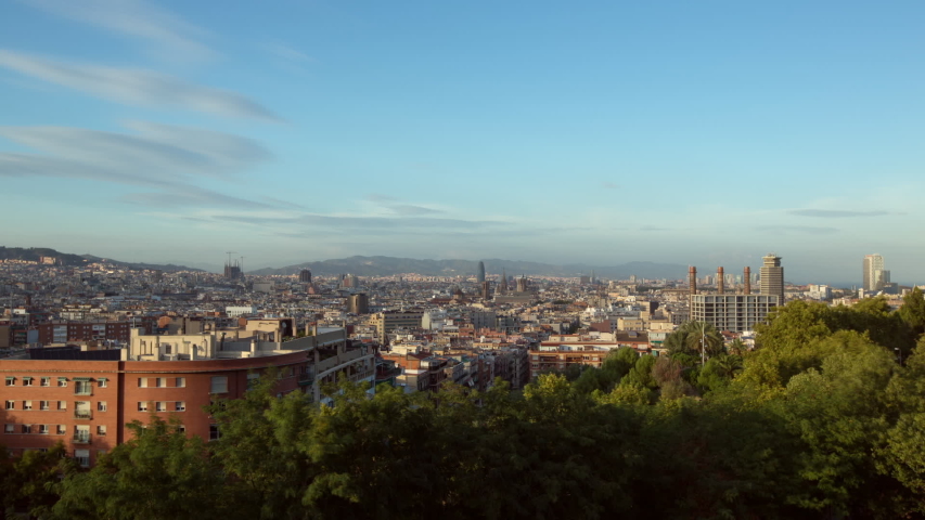 Time lapse: Barcelona cityscape against sky from day to sunset