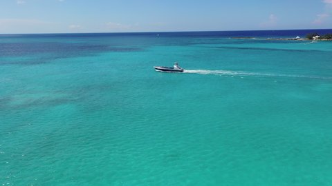 Aerial: Sightseeing Yacht Sailing Through Glistening Aquamarine Water - Nassau, Bahamas