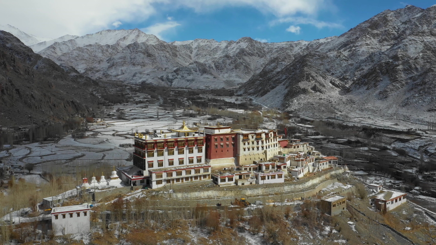 Aerial view of Phyang Monastery on a winter day. It belongs to the Drikung Kagyu school of Tibetan Buddhism. Location: Indus Valley in Ladakh next to the Srinagar - Leh highway at 3.550 m altitude. Royalty-Free Stock Footage #1041612958