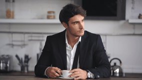 businessman smelling and drinking coffee