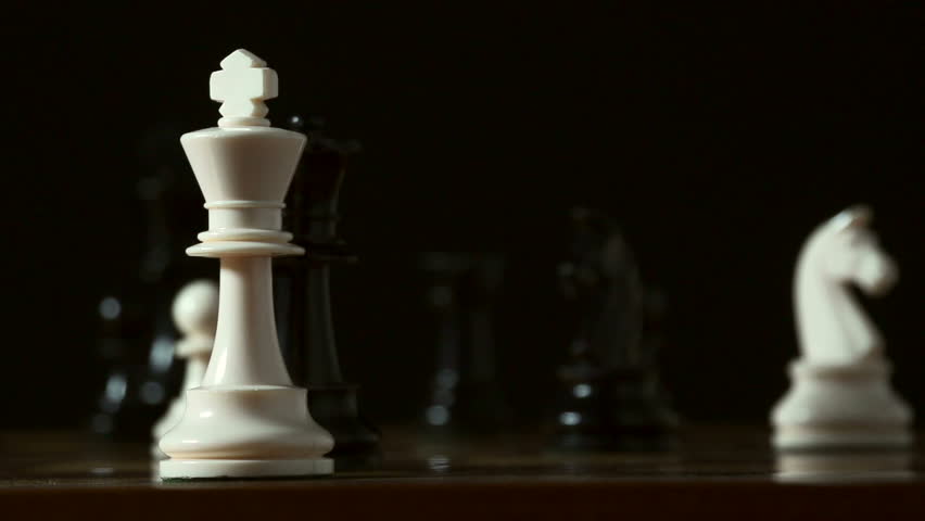 Defeat in slow motion -- chess player resigns by knocking over his king with his hand. Graceful, smooth slo-mo, shot at 240fps on the Sony FS700.