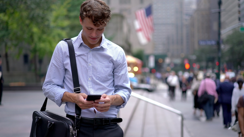 Male professional with leather briefcase for corporate documents standing at street area and using 4g for checking financial situation of money exchange, Caucasian businessman making online banking
 | Shutterstock HD Video #1041631951