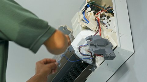 Nakhon Ratchasima, Thailand – Sep 1, 2019 : Technician service repairing air conditioner indoors