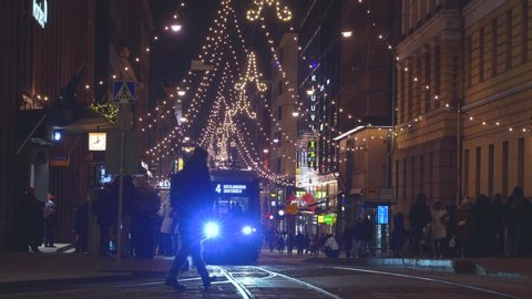 HELSINKI, FINLAND - DEC 20, 2018 - Aleksanterinkatu Street on Christmas time with trams and people