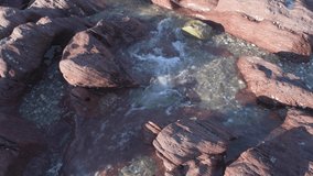 water flowing over stones at beach	