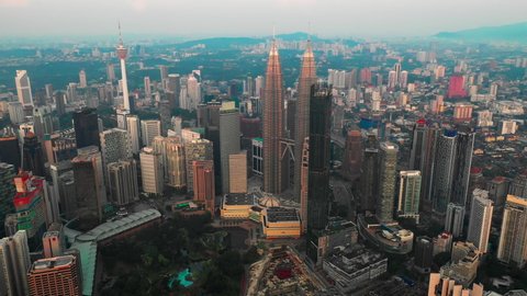4k video of Aerial View Of Kuala Lumpur City Skyline During Day time with fly over motion camera movement with many building in the city