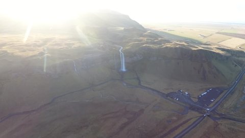 Aerial flight with drone over the famous Skogar waterfall in Iceland. It is located on the South of the island. Image taken with action drone camera causing distortion and blur. Slow motion shot