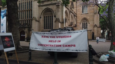Sydney NSW Australia - Nov 23 2019: people rally protest sign banner against uyghur minority concentration camp Xinjiang re-education camps near Town Hall. to save uyghurs held in captive