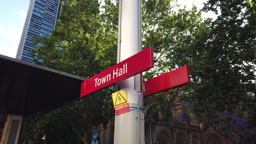 new street level tram light rail train line  through Central business district on george st. red sign of Town Hall Station stop. soon open for operation to public. Transport for New South Wales.TfNSW