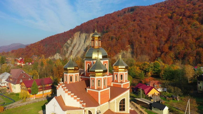 4K Aerial drone video of Orthodox Church with gilded domes in Yaremche in Carpathians mountains