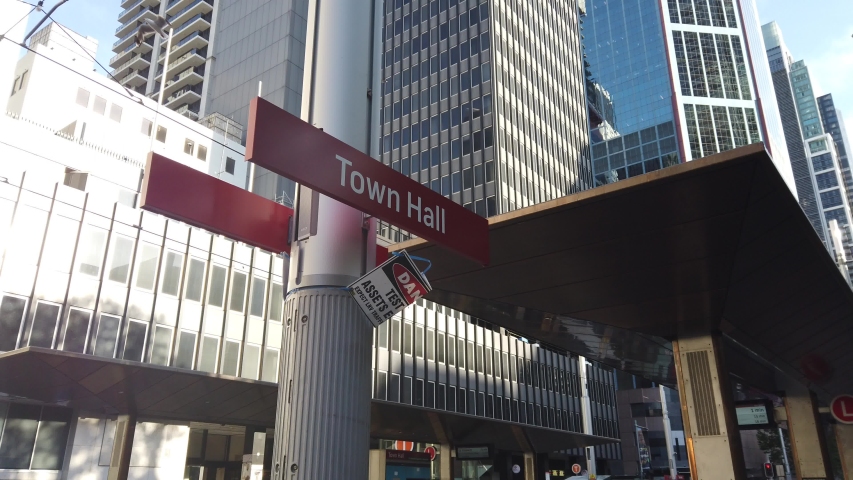 new street level tram light rail train line  through Central business district on george st. red sign of Town Hall Station stop. soon open for operation to public. Transport for New South Wales.TfNSW