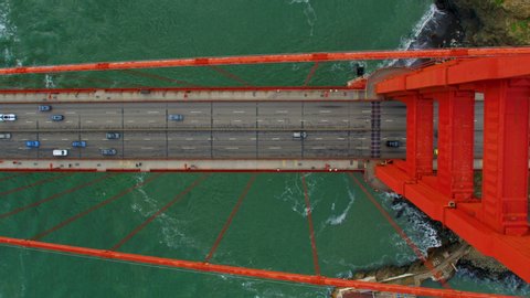 High aerial view of the Golden Gate Bridge. San Francisco, US. It connects the San Francisco peninsula to Marin County.  US route 101  and SR 1 full of traffic. Shot on Red weapon 8K.