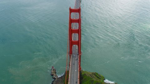 High aerial view of the Golden Gate Bridge. San Francisco, US. It connects the San Francisco Bay to Marin County.  US route 101  and SR 1 full of traffic. Shot on Red weapon 8K.