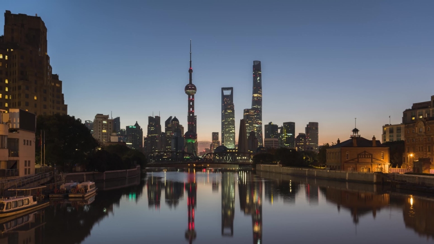 Night to Dusk to Day Time-lapse of Shanghai Skyline. Sunrise of Pudong Downtown. Early Morning of Chinese Financial District.