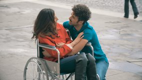 Young woman Wheelchair talking,flirting with Her Boyfriend in the city - Powered by Shutterstock - Get 15% off with code: PIKWIZARD15