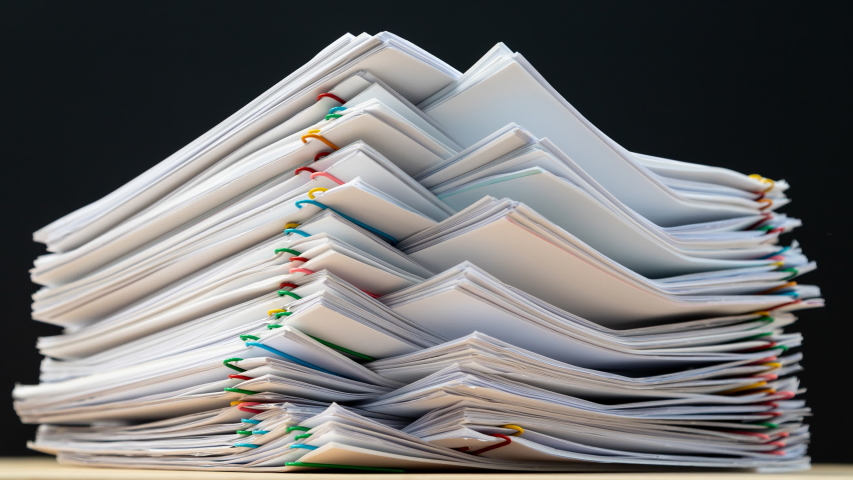 Stack overload document report paper with colorful paperclip on black background, bureaucracy business concept footage paperless used – 4K Stop motion. | Shutterstock HD Video #1041717958
