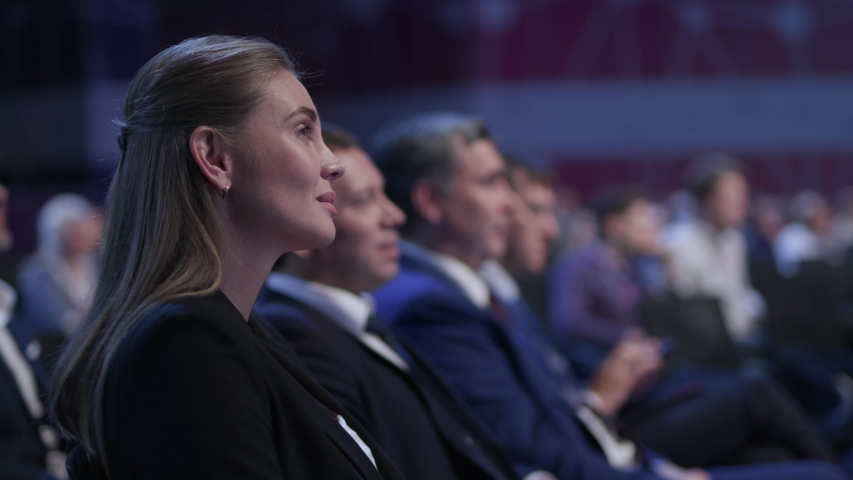 Business Meeting at Conference or Crowded Political Summit. Caucasian People Smile at Speaker Speech. Economic Briefing and Information for Success Strategy for Businesswoman. Row of Seats at Congress | Shutterstock HD Video #1041720427