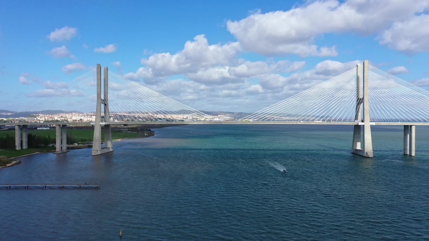 Aerial view over Vasco Da Gama Bridge in Lisbon - aerial drone footage