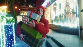 Young woman in hurry running with Christmas presents dropping boxes on ground on winter city street. Busy holiday shopping. Christmas time. Fun concept. - Powered by Shutterstock - Get 15% off with code: PIKWIZARD15
