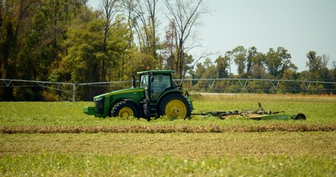 Whigham, Georgia / USA - August 28, 2019: John Deere Tractor on Peanut Farm, 4K