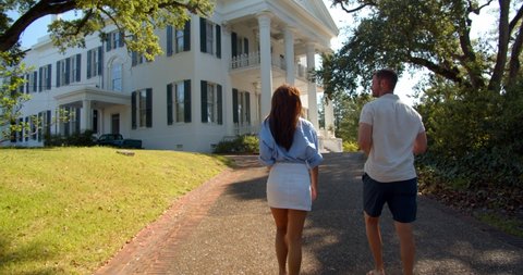 Natchez, Mississippi, / USA - August 23, 2019: Couple Walking Path to Historic Longwood Mansion, Natchez, Mississippi