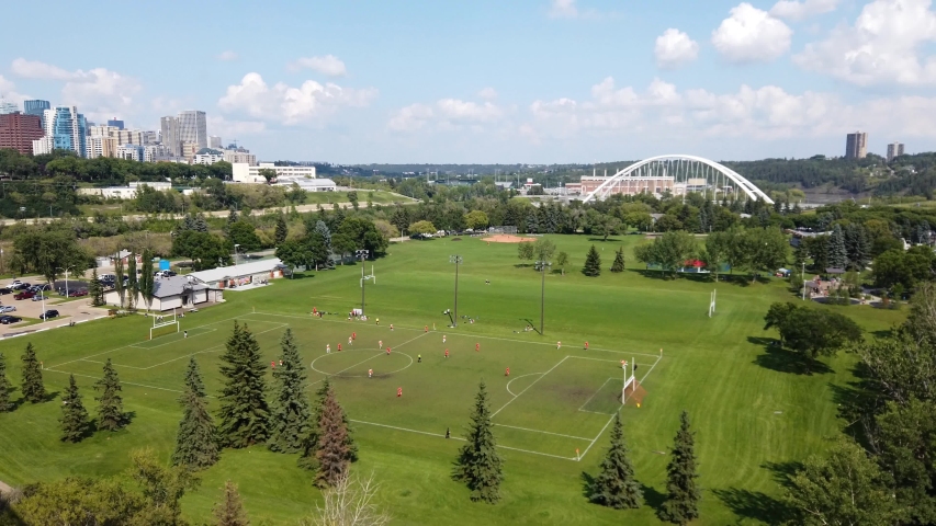Soccer Game being played outside near downtown Edmonton
