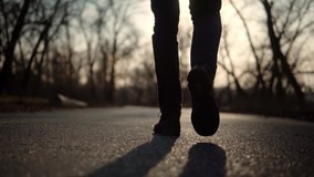 Confidence Man Feet Walking On Road At Sunrise. Lonely Walker Guy Rest On Holiday. Man Legs Walking On Park. Businessman Legs On Sneakers Relaxing At Fall. Male In Leather Shoes Walk On Autumn Road. - Powered by Shutterstock - Get 15% off with code: PIKWIZARD15
