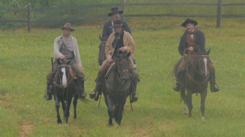 VIRGINIA - JUNE 20, 2018. Re-enactment recreation of classic Old West, 1800s Western Cowboys riding on horseback. Cowboys and Outlaws. 1870-1890 western life. Guns and shootouts. . Tombstone. Horses