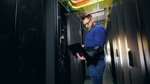 IT technician is analyzing a server on his laptop