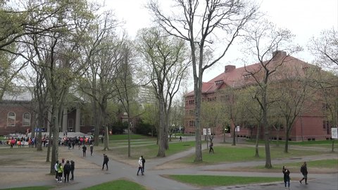 Cambridge,  Massachusetts / USA - APRIL 26, 2019:
Students at the Harvard Yard center near Sever Hall & Memorial Church. 