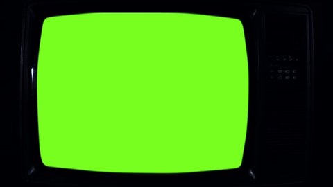 Old Retro TV Turning On Green Screen with Color Bars. You can Replace Green Screen with the Footage or Picture you Want with “Keying” effect in After Effects (check out tutorials on YouTube). 
