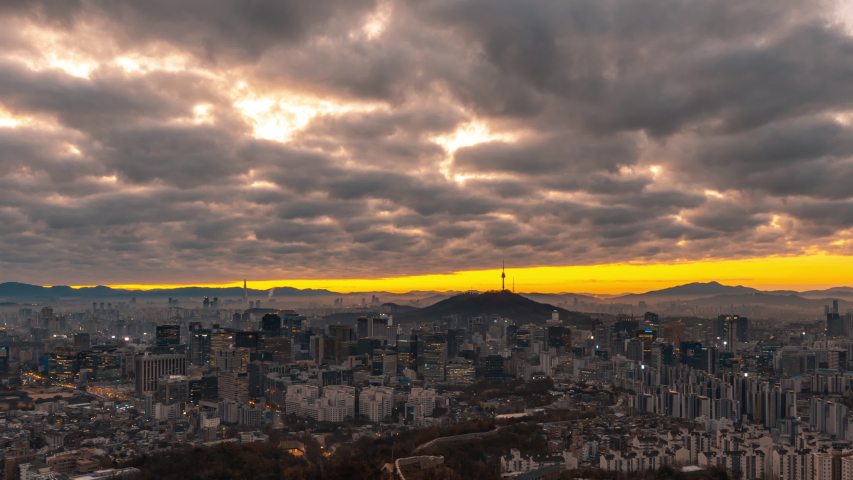 Time lapse4k. view of seoul City sky line , south korea, showing landmark Seoul tower in the financial district at morning