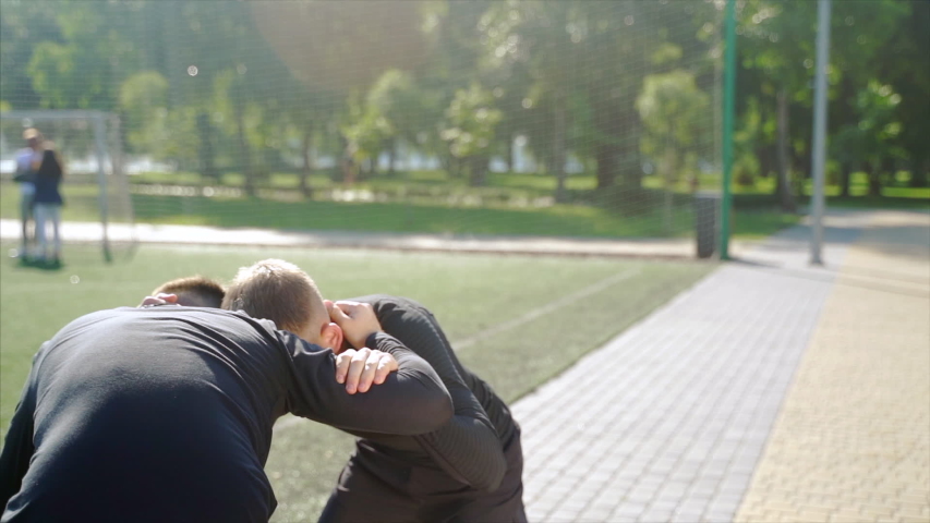 Two fighters practice mma skills in training