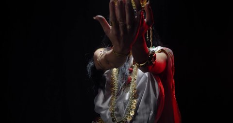An indian deity, goddess Saraswati in white dress with jewelry, dancing, 4k
