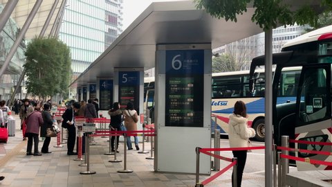 Tokyo , Tokyo / Japan - 10 08 2018: Passenger waiting and lineup at bus stop terminal front to Yaesu Central entrance-exit of Tokyo Station.